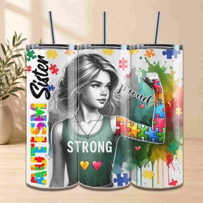 Tumbler with colorful design featuring a woman and text on a wooden surface.