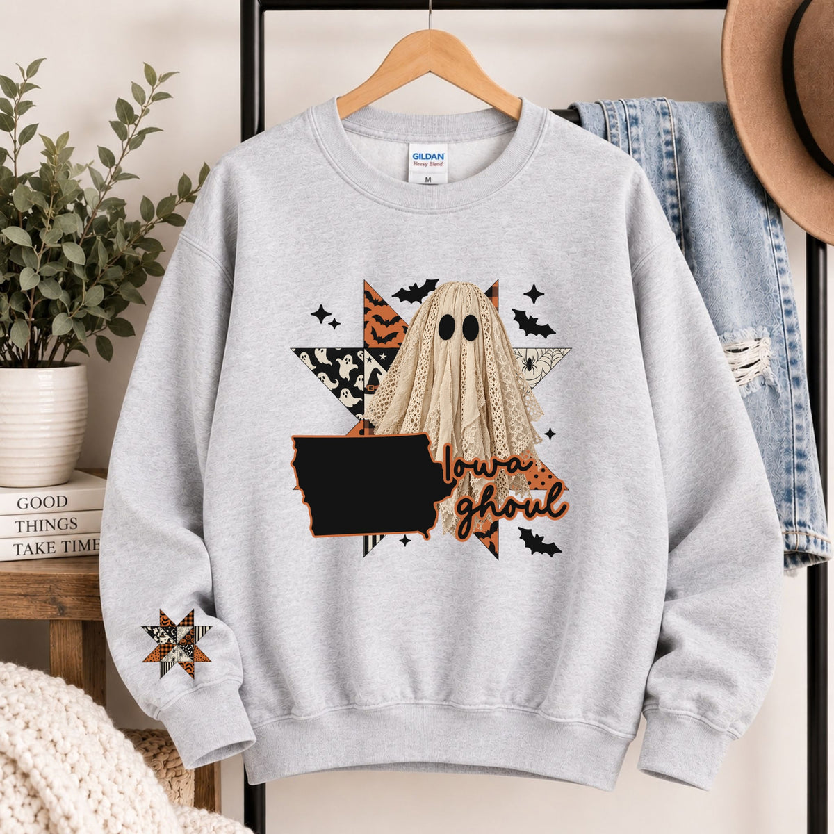 Light gray crewneck sweatshirt with black Louisiana state graphic and cartoon ghoul face