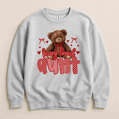 Gray sweatshirt with teddy bear graphic and text 'Beary Loved Aunt' on a beige background