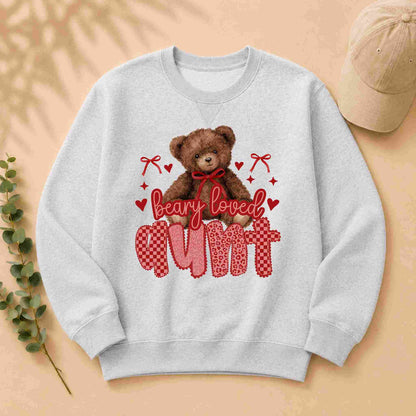 Gray sweatshirt with teddy bear graphic and 'Beary Loved Mum' text on a beige background