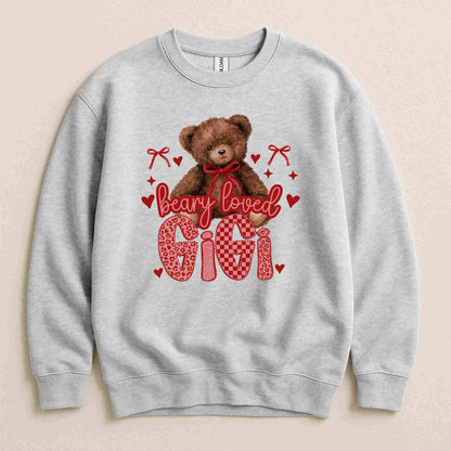 Gray sweatshirt with a teddy bear graphic and 'bearly loved Gigi' text on a beige background