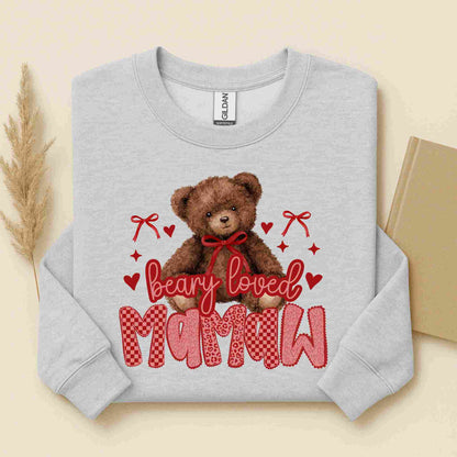 Gray sweatshirt with a teddy bear graphic and text on a beige background