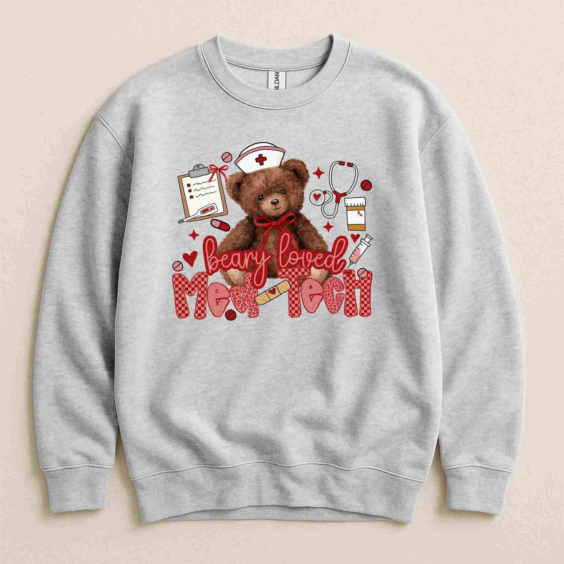 Gray sweatshirt with a teddy bear graphic and text on a beige background