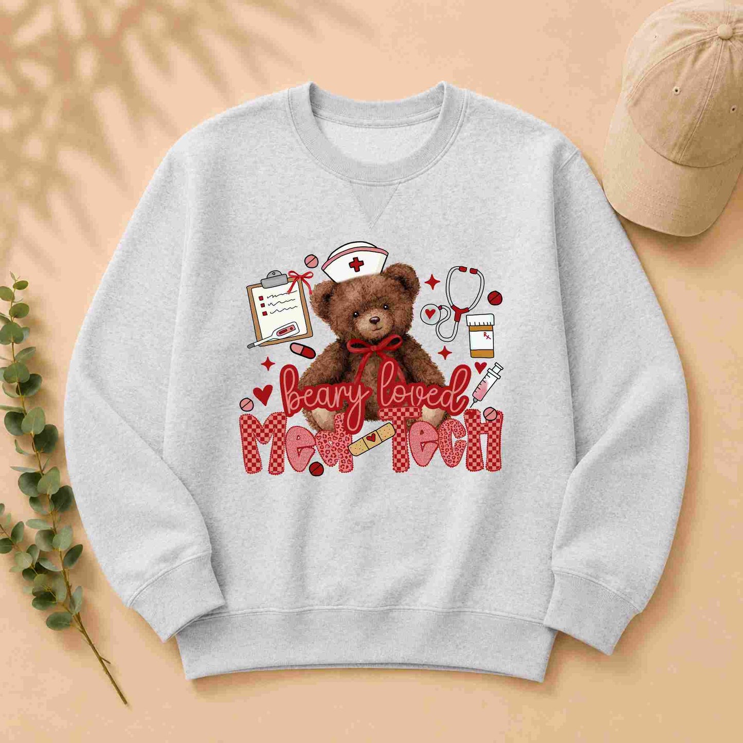 Gray sweatshirt with teddy bear and text design on a beige background