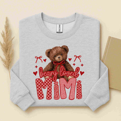 Gray sweatshirt with a teddy bear and 'bearly loved MIMI' text on a beige background