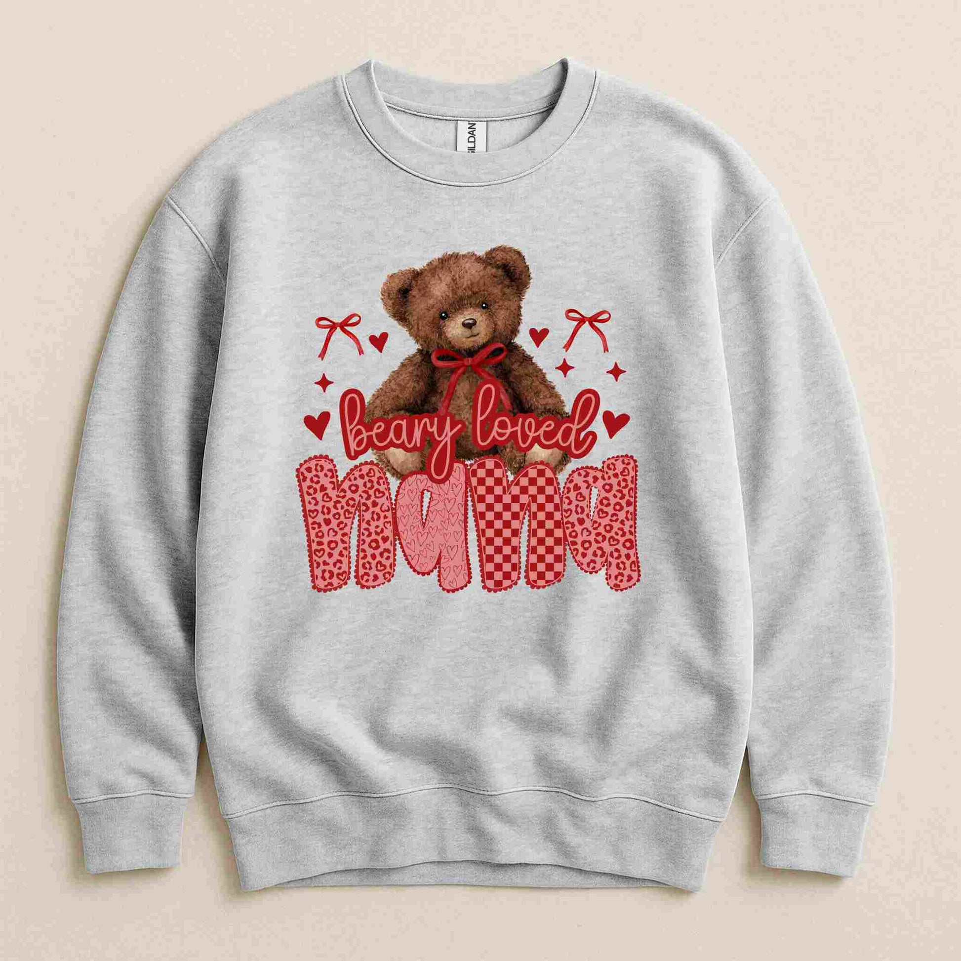 Gray sweatshirt with a teddy bear and 'Beary Loved Mama' text on a beige background
