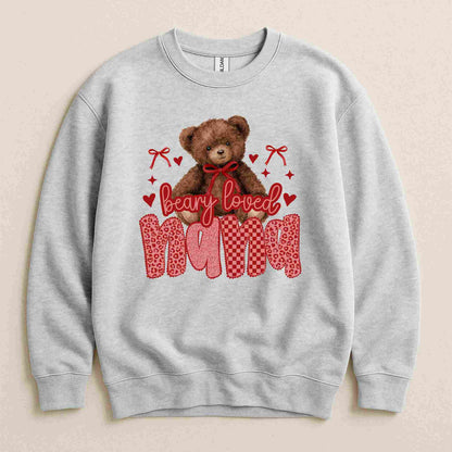 Gray sweatshirt with a teddy bear and 'Beary Loved Mama' text on a beige background