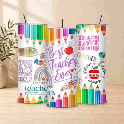 The Best Teacher Ever 20oz tumbler features a colorful pencil design and teacher appreciation message, making it a perfect teacher gift—shown on a wooden surface with a plant in the background.