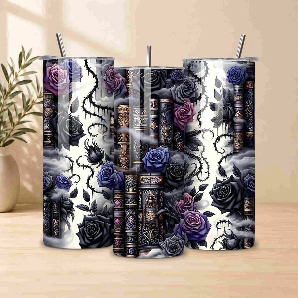 The Dark Book Lover 20oz Skinny Tumbler by Becca's Banging Designs LLC features ornate books, black and purple roses, and thorny vines on a cloudy backdrop—perfect for book lovers. A beige vase with leaves is softly blurred in the background.