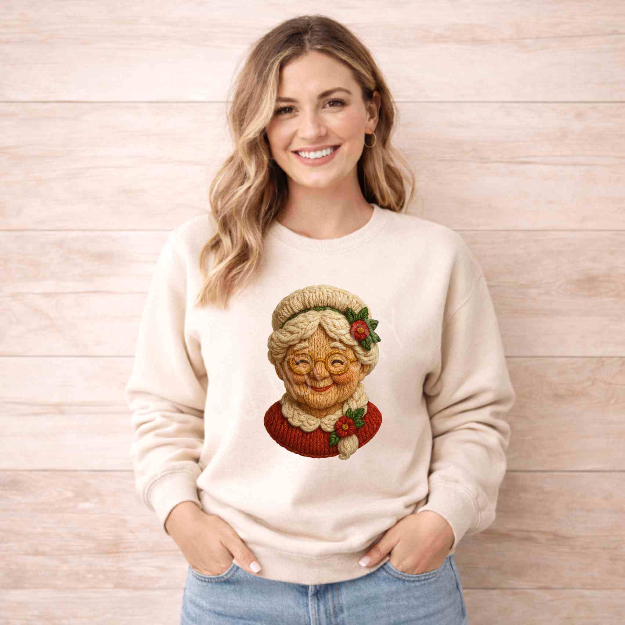 Woman wearing a Vintage Mrs. Claus sweatshirt with a nostalgic Mrs. Claus graphic, perfect for the holiday season.