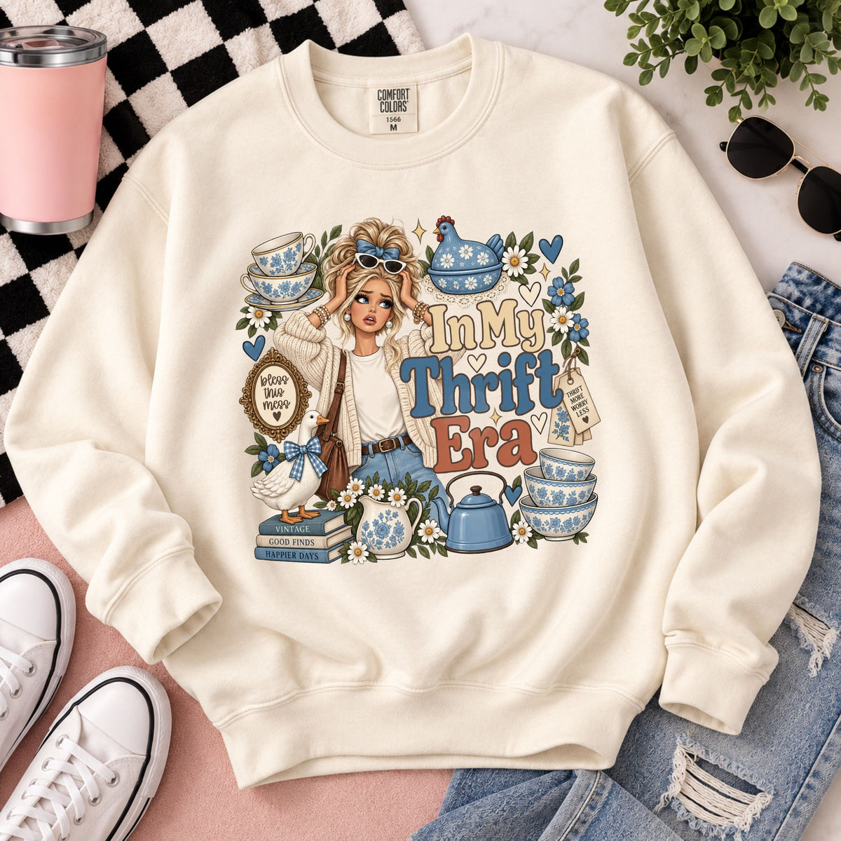 Cream graphic sweatshirt with long sleeves and front 'In My Thrift Era' illustration