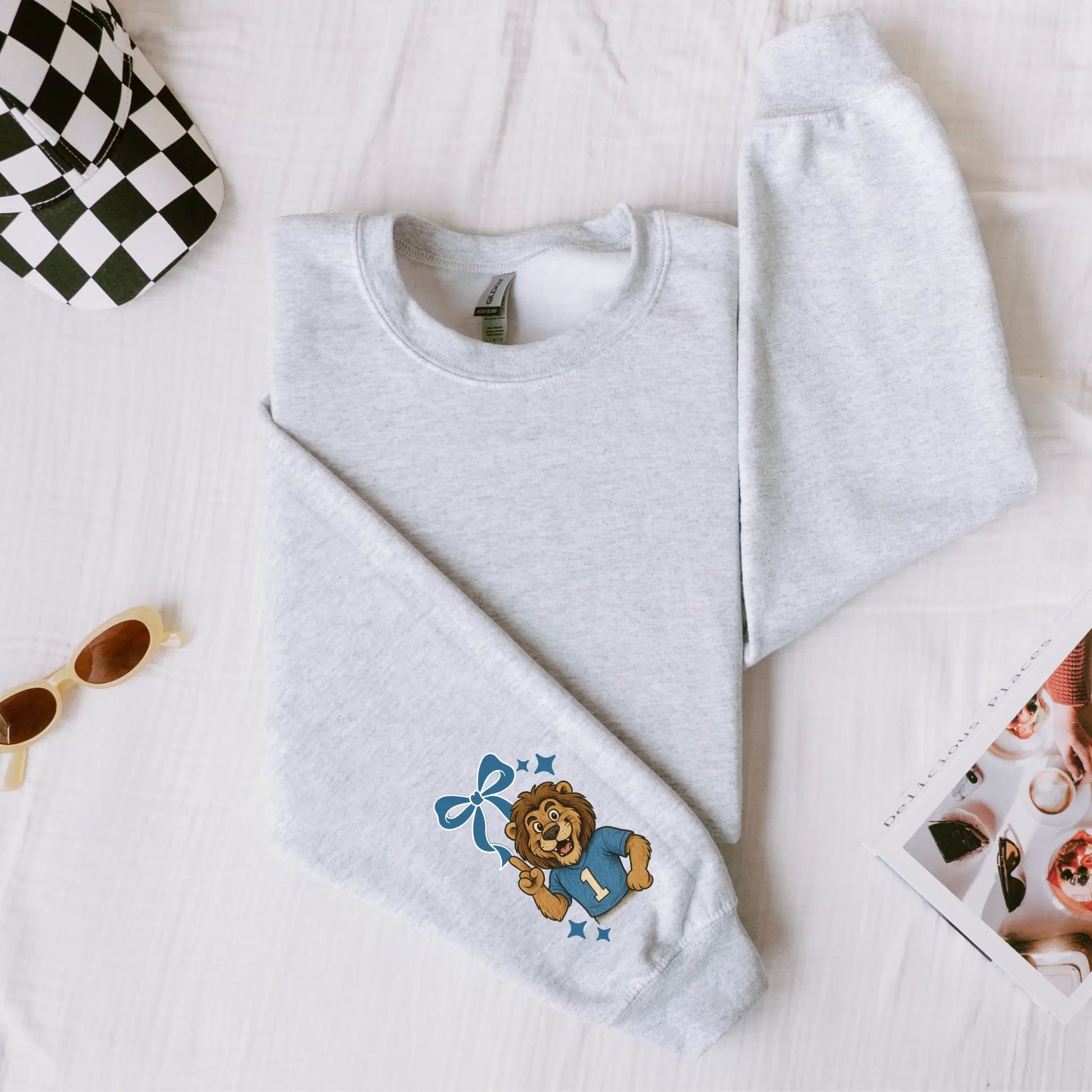 Lions Seersucker Sweatshirt: Game Day Pullover with Cartoon Lion & Football Style. 