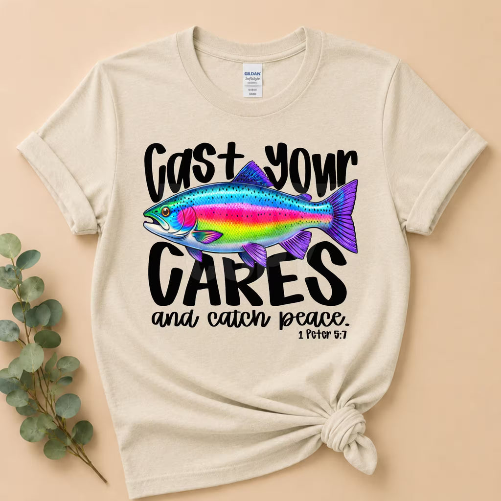 Beige t-shirt with a colorful fish graphic and text on a beige background
