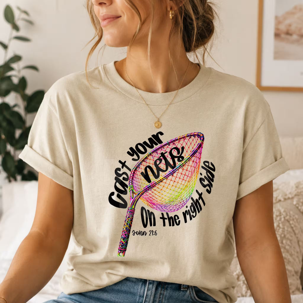 Person wearing a t-shirt with a colorful net graphic and text.