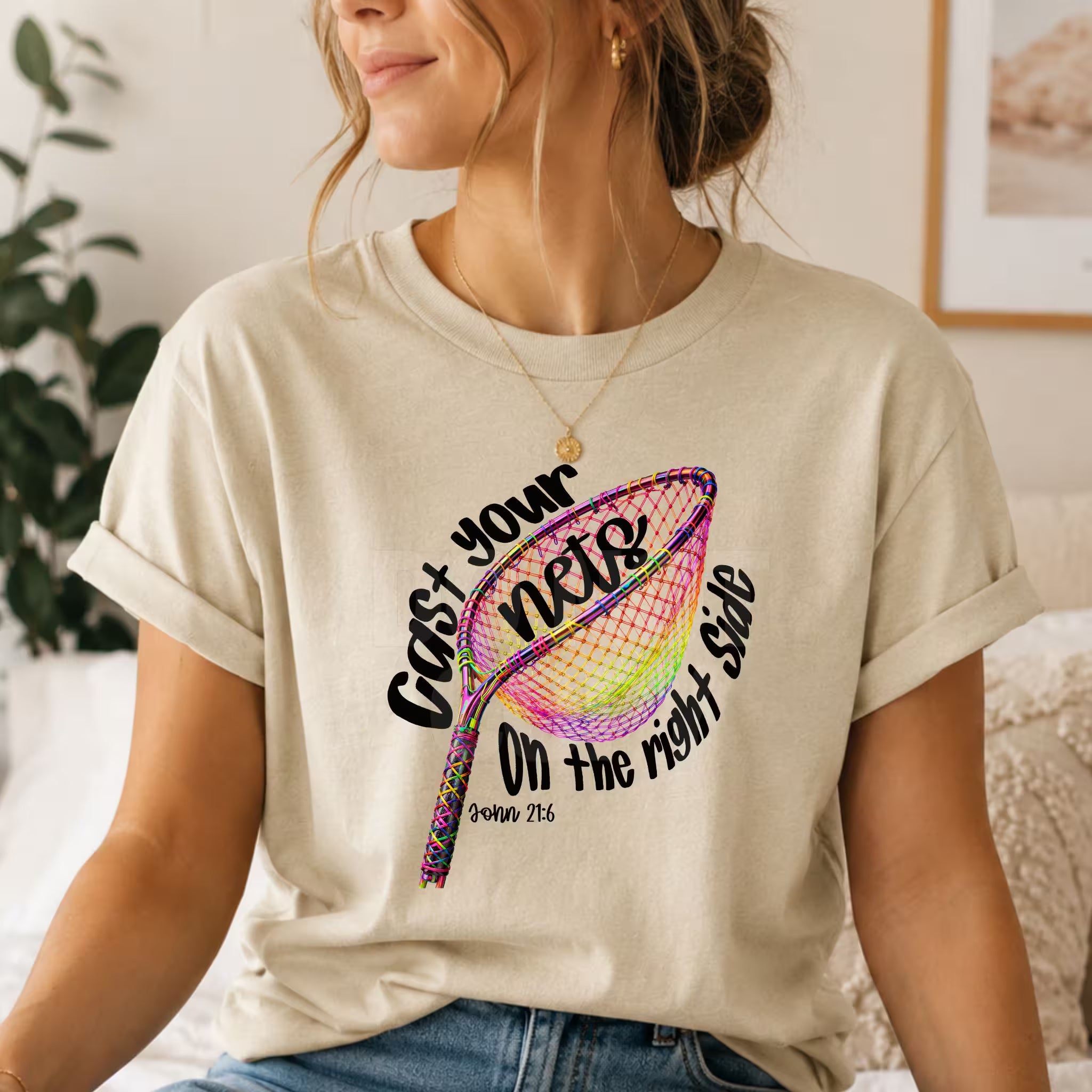 Person wearing a t-shirt with a colorful design and text