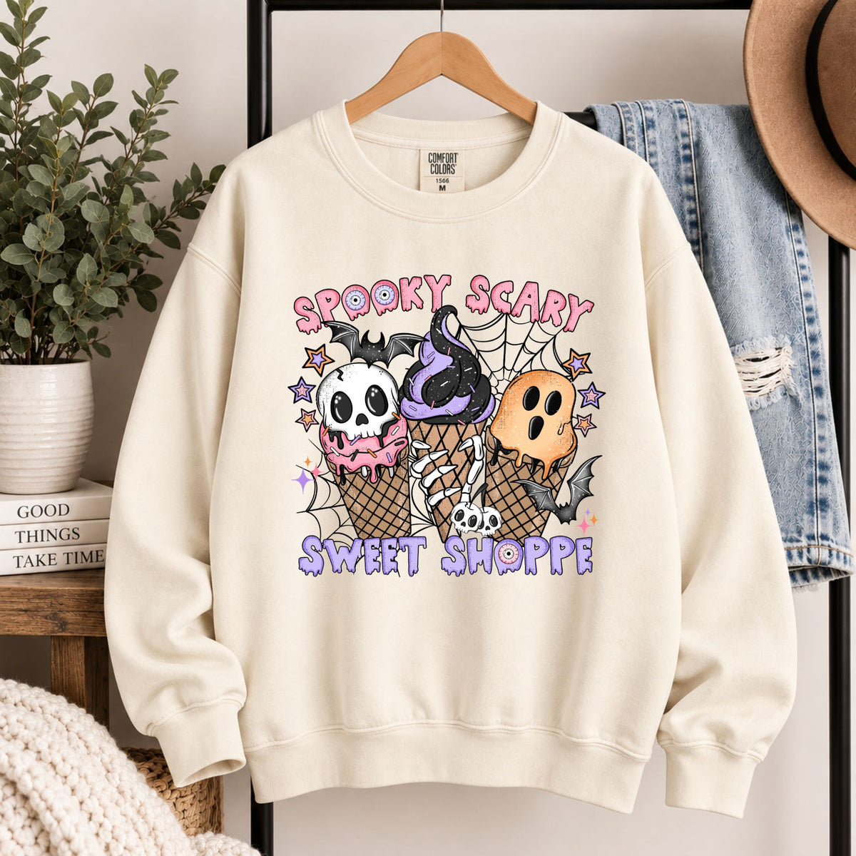 Cream crewneck sweatshirt with colorful skull and ice-cream cone illustration