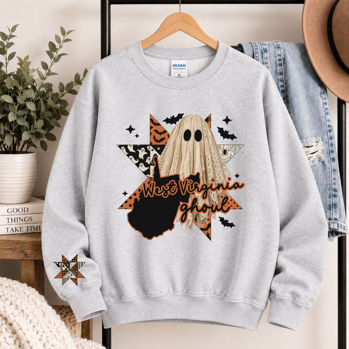 Light gray crewneck sweatshirt with West Virginia ghoul graphic and state silhouette