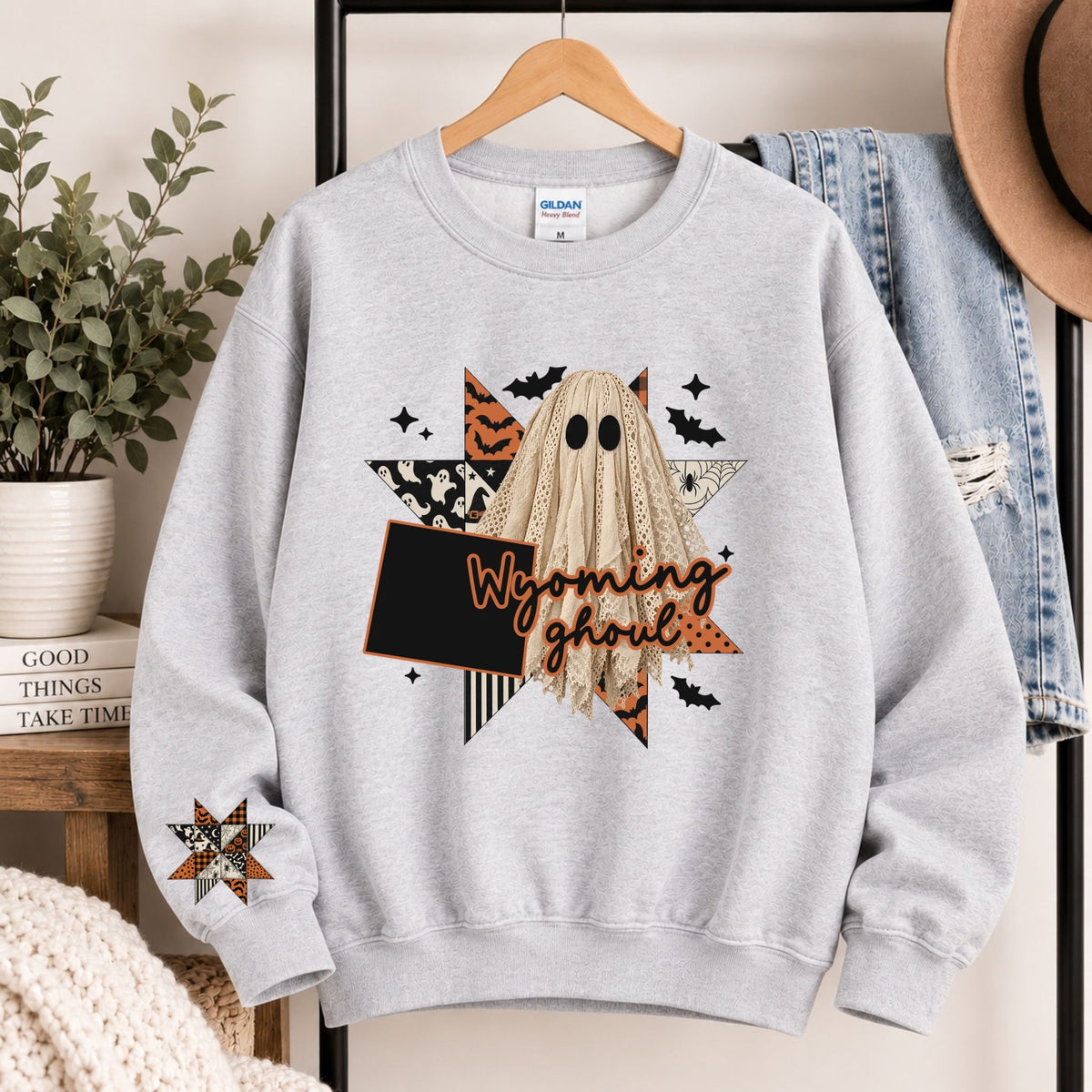 Light gray crewneck sweatshirt with Wyoming state ghost Halloween graphic