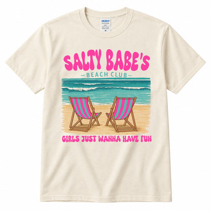 Cream graphic t-shirt with "SALTY BABE'S" beach club print and two pink striped chairs