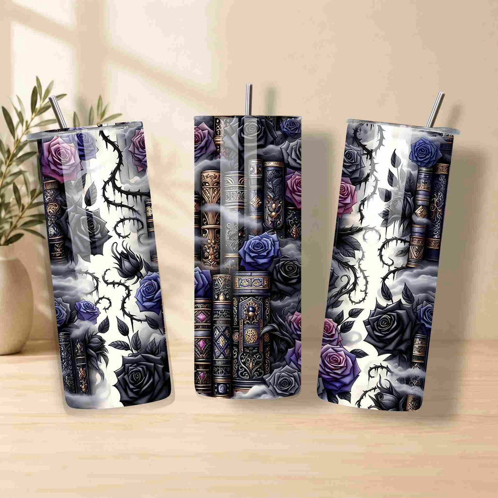 The Dark Book Lover 20oz Skinny Tumbler by Becca's Banging Designs LLC features black, purple, and blue roses with vintage books and dark thorns on a smoky white finish—a perfect gift for book lovers.