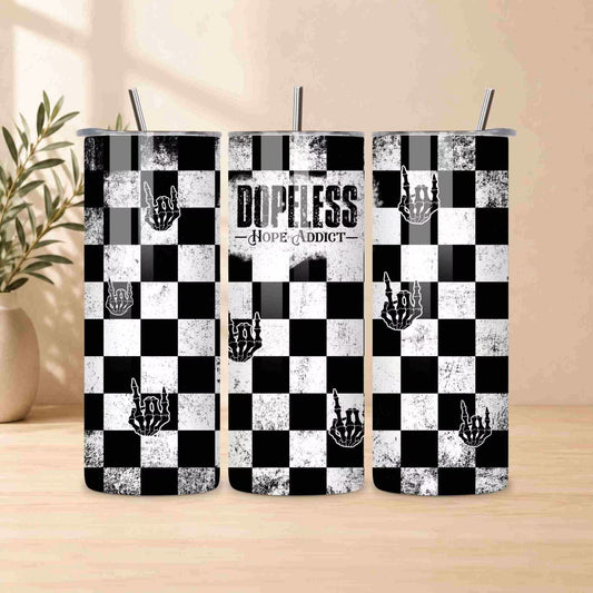 Three black and white checkered tumblers with 'Dopeless Hope Addict' text on a wooden surface.