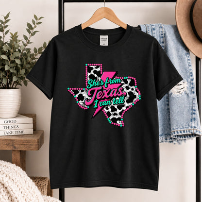 Black crewneck T-shirt with Texas cow print graphic on hanger