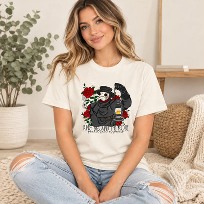 Cream graphic tee with plague doctor, red roses, lantern print on front