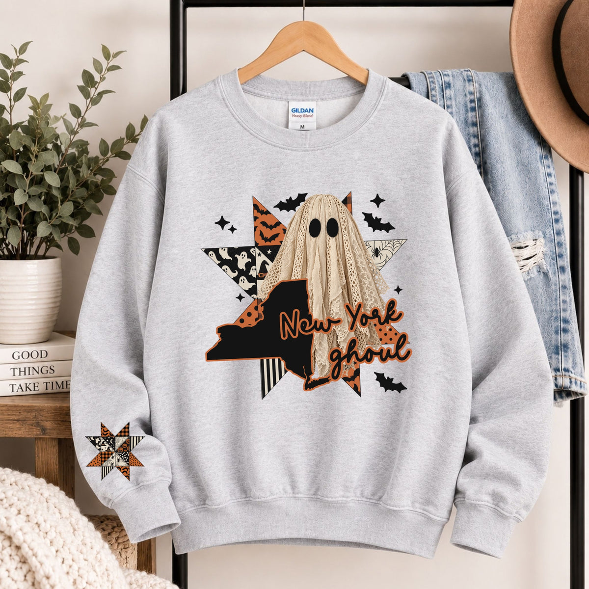Light gray crewneck sweatshirt with hooded ghost and New York ghoul graphic