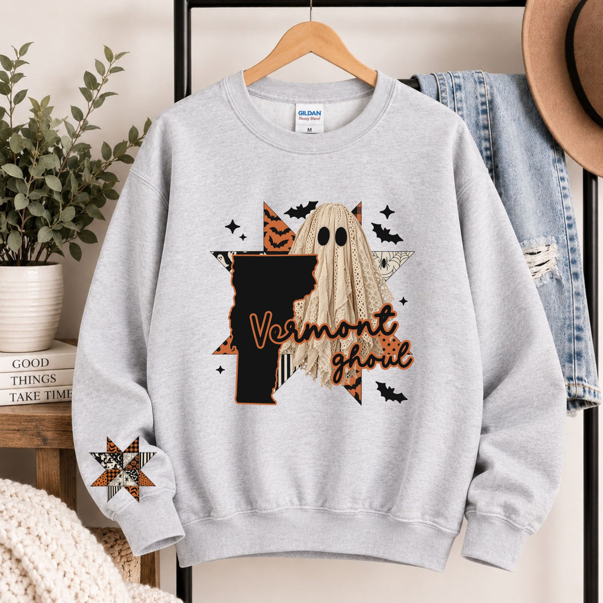 Light gray crewneck sweatshirt with Vermont ghoul graphic and state silhouette