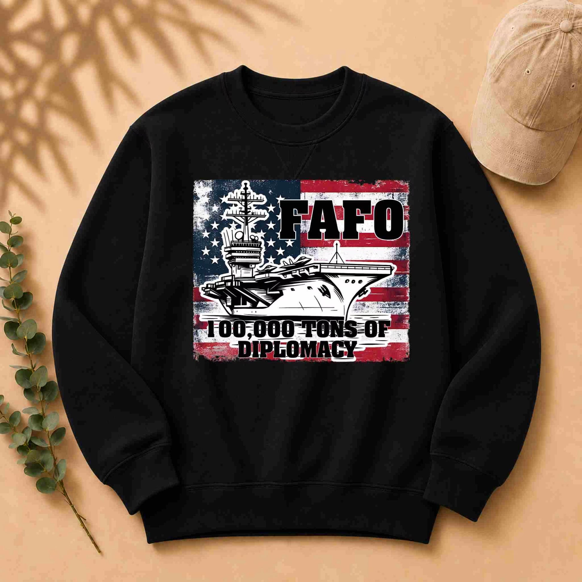 Black sweatshirt with a graphic design featuring an American flag and text on a beige background.
