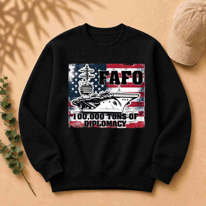Black sweatshirt with a graphic design featuring an American flag and text on a beige background.