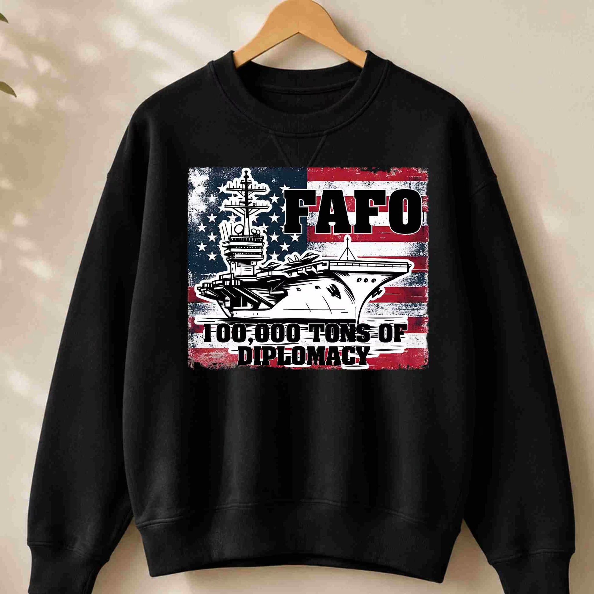 Black sweatshirt with a graphic design featuring text and images on a beige background