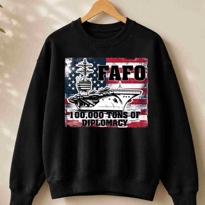 Black sweatshirt with a graphic design featuring text and images on a beige background