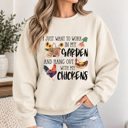 Cream crewneck sweatshirt with colorful garden and chicken graphic, long sleeves.