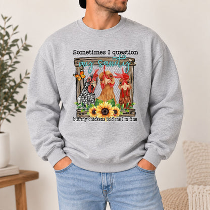 Grey crewneck sweatshirt on model with front chicken graphic and quote text at chest.