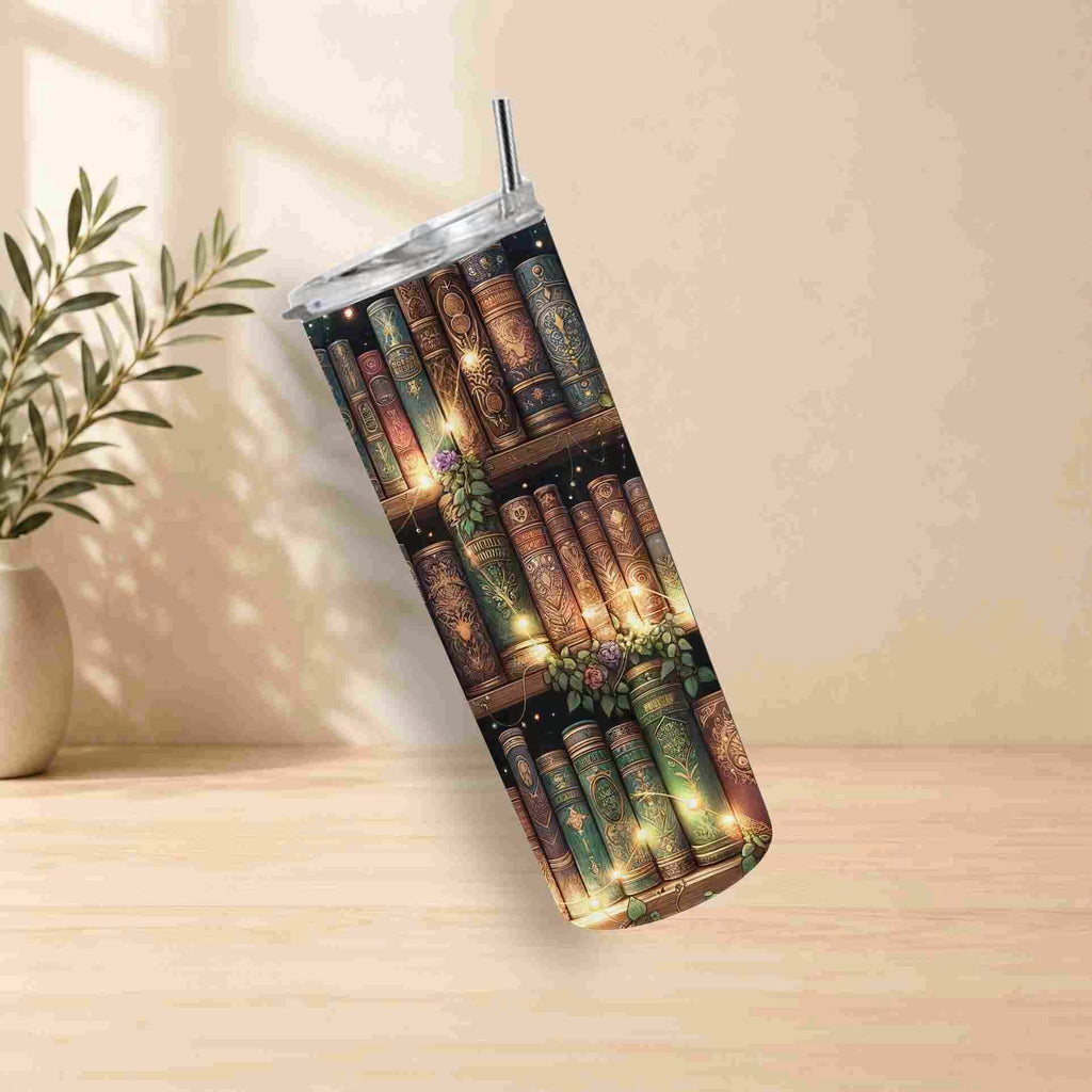 Tumbler with bookshelf design on a wooden surface with a plant in the background