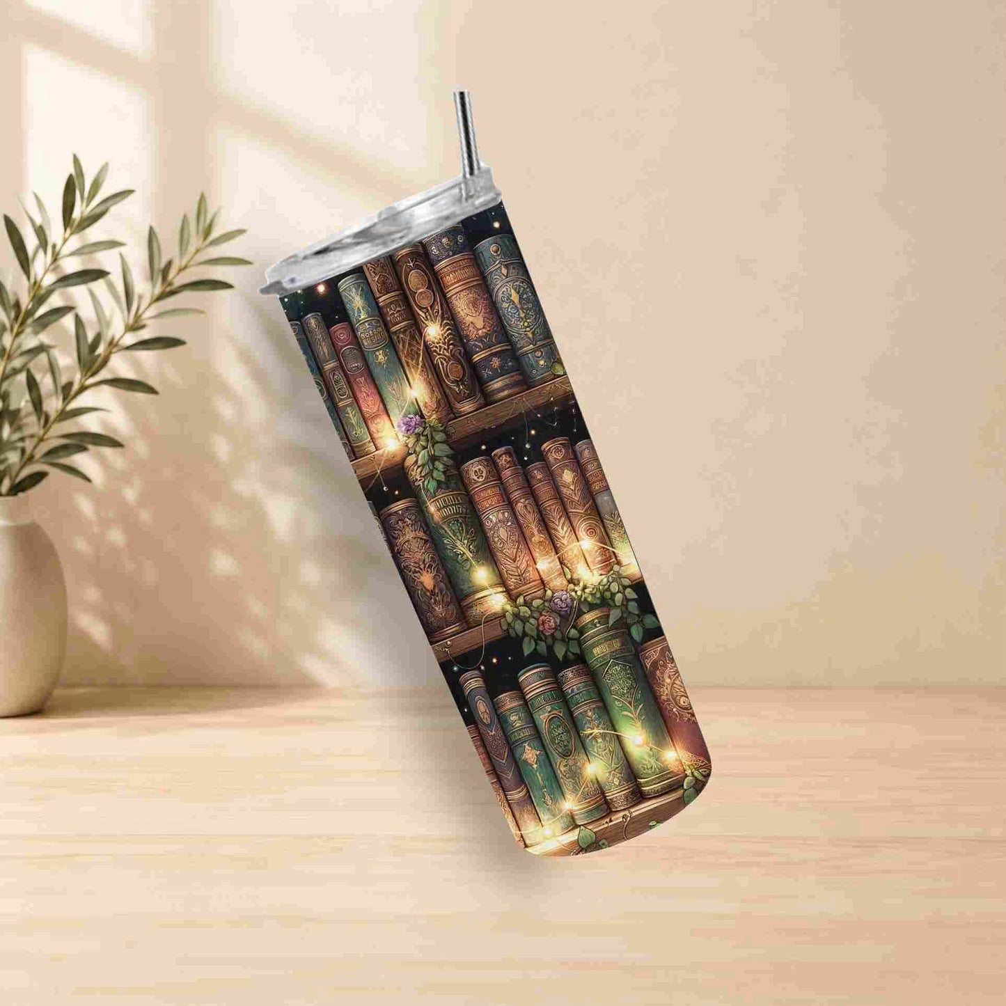 Tumbler with bookshelf design on a wooden surface with a plant in the background