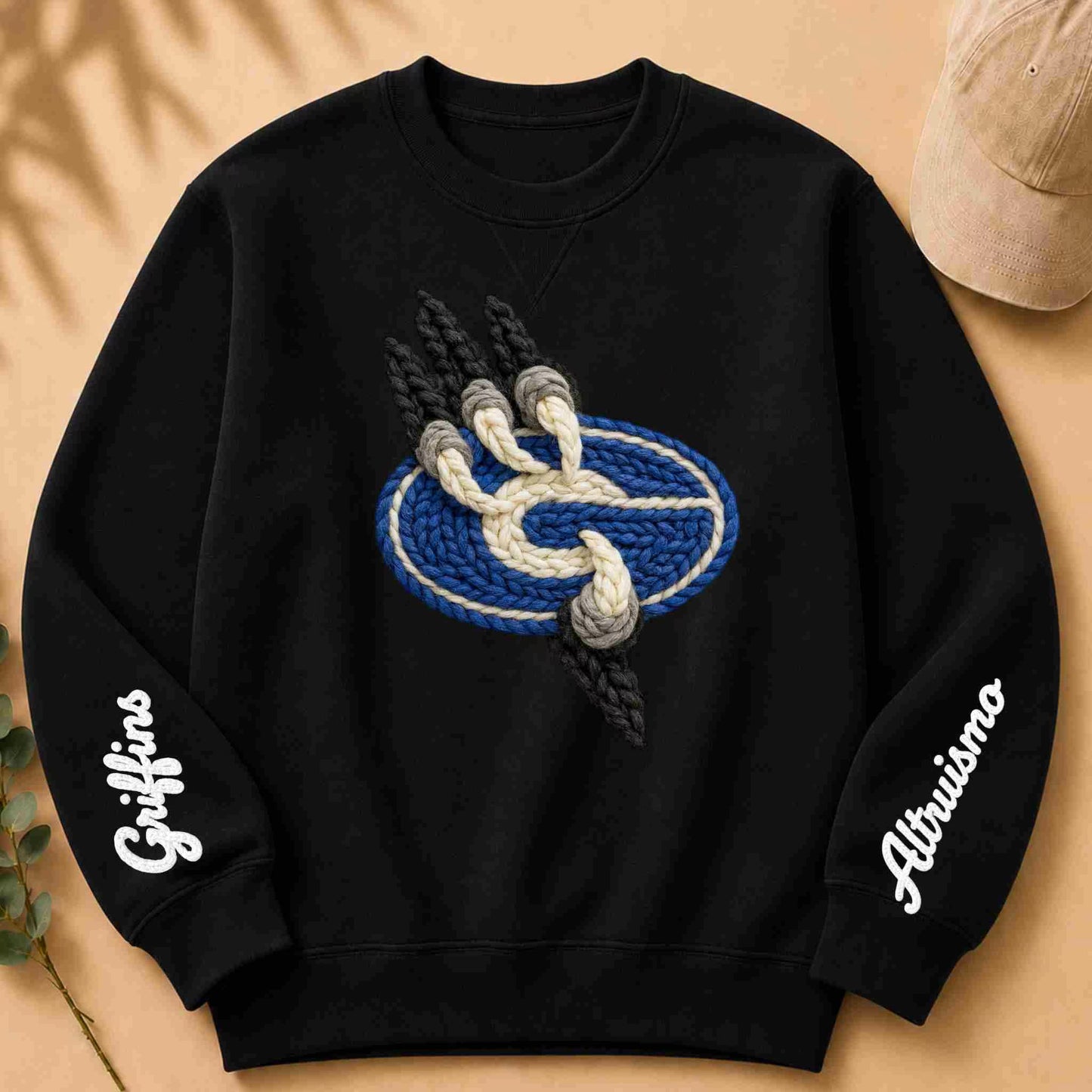 Black sweatshirt with a blue and white logo and 'Griffins' text on sleeves against a beige background