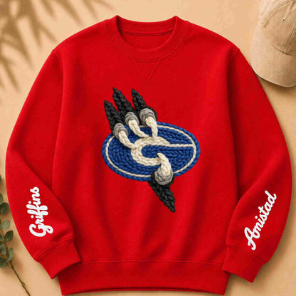Red sweatshirt with a logo and text on sleeves against a beige background