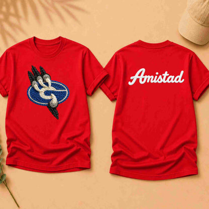 Red t-shirt with a logo on the front and 'Amistad' text on the back, on a beige background.