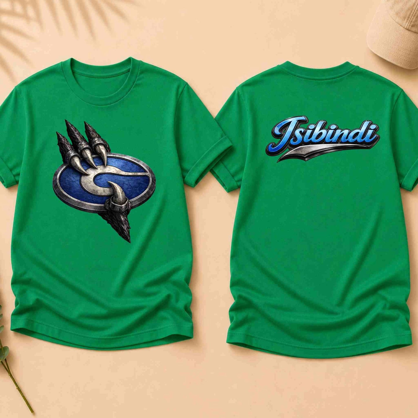 Green t-shirt with a logo on the front and 'Isibindi' text on the back, displayed on a beige background.