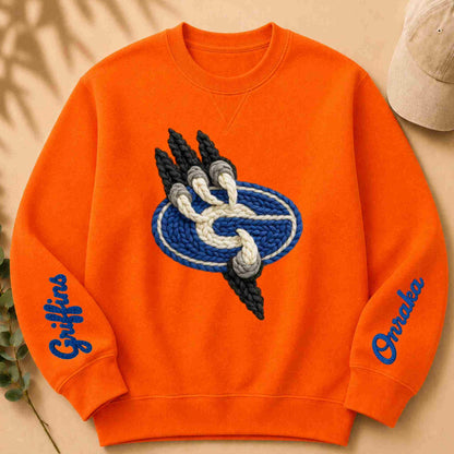 Orange sweatshirt with yarn-link design and 'Griffins' text on a beige background