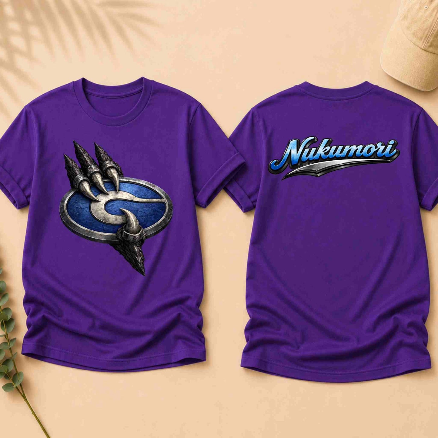 Purple t-shirt with a logo on the front and 'Nukumori' text on the back, displayed on a beige background.