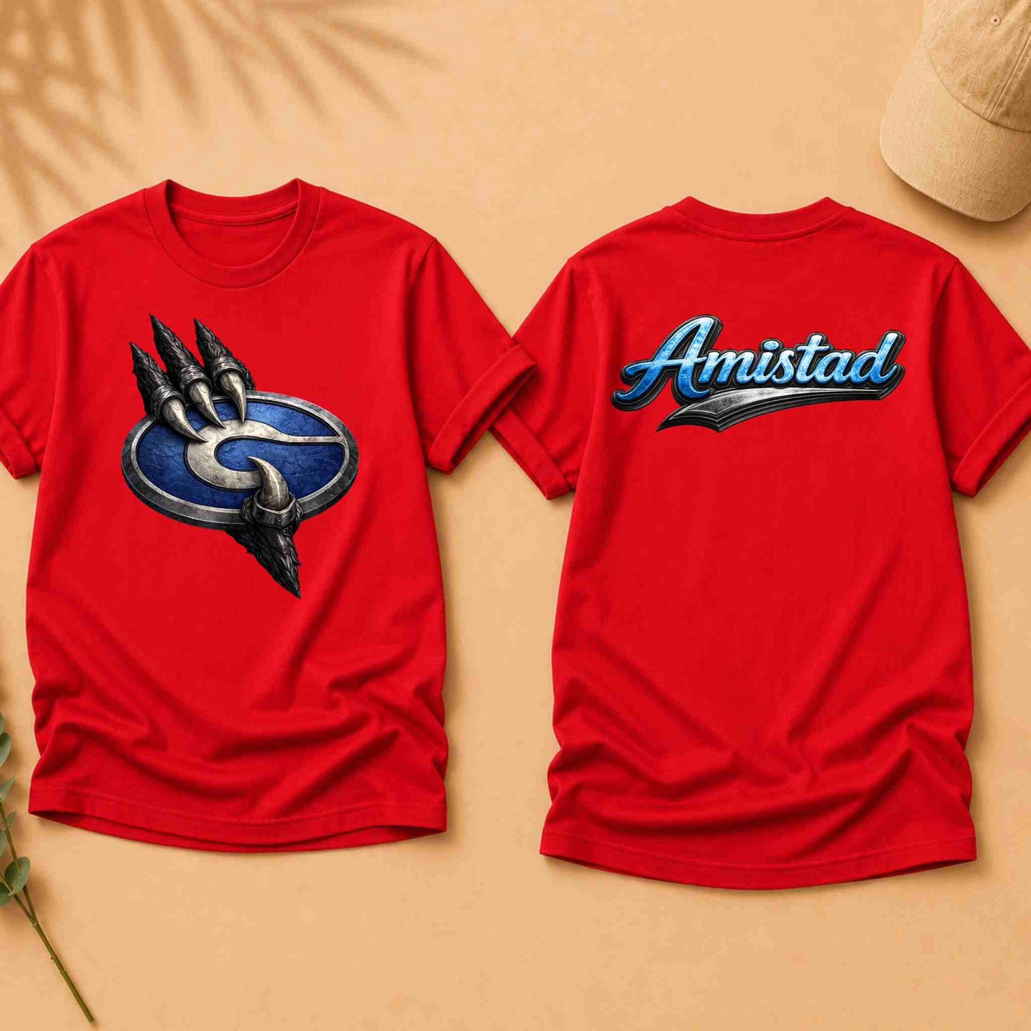 Red t-shirt with a logo on the front and 'Amistad' text on the back, on a beige background.