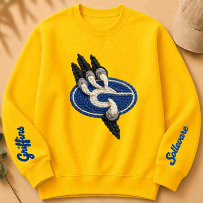 Yellow sweatshirt with a School logo and text on a beige background