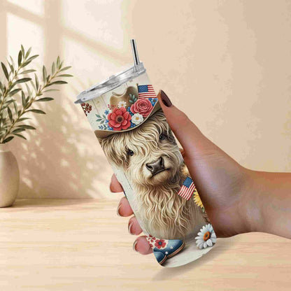 Tumbler with a llama design held by a hand on a light wooden surface.