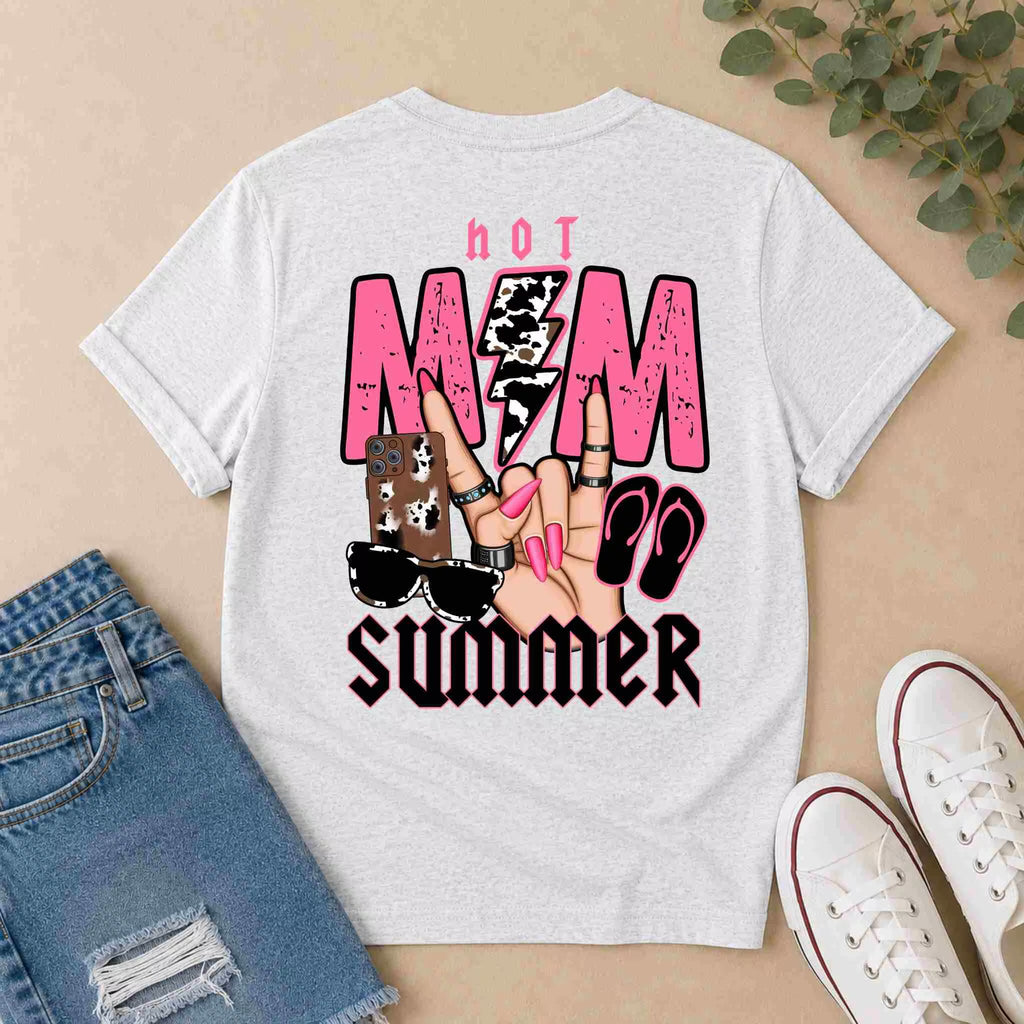 The Hot Mom Summer Tee by Becca's Banging Designs LLC features bold back graphics with sunglasses, flip-flops, and a peace sign—perfect for trendy moms who love fun women's graphic shirts. Pair with denim shorts and white shoes for a cool summer look.