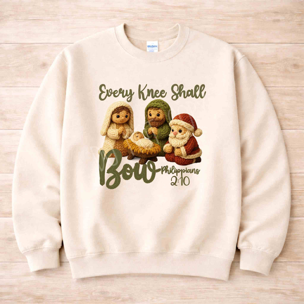 Every Knee Shall Bow Christmas Sweatshirt featuring a cozy design with adorable nativity characters.