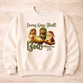 Every Knee Shall Bow Christmas Sweatshirt featuring a cozy design with adorable nativity characters.