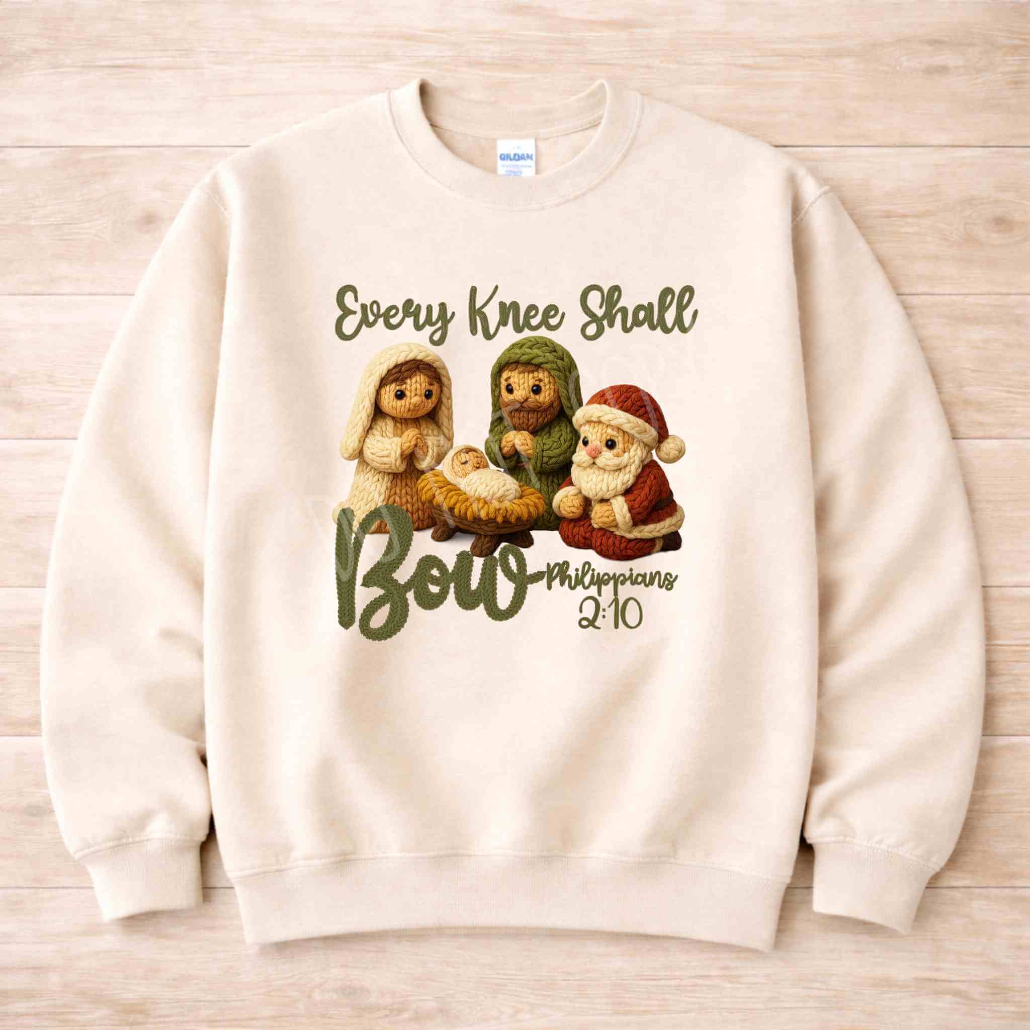 Every Knee Shall Bow Christmas Sweatshirt featuring a cozy design with adorable nativity characters.